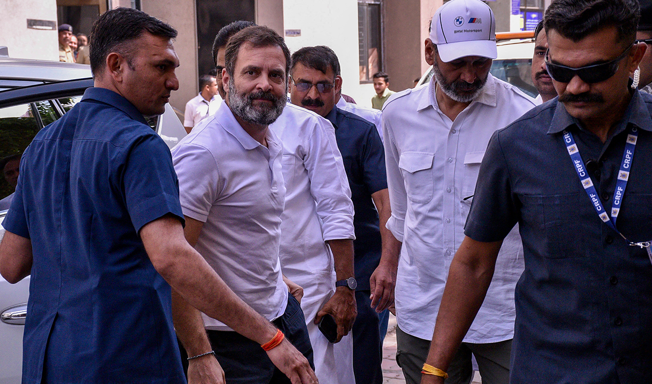 India's Congress party leader Rahul Gandhi (2L) arrives at the district court in Surat on March 23, 2023. (AFP/FILE)