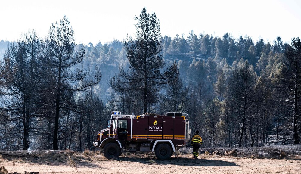A fire truck is pictured in a forest area near the village of Los Peiros, on Mar. 25, 2023, affected by a wildfire that began on Mar. 23 near Villanueva de Viver, some 90 kilometres north of Valencia. (AFP)