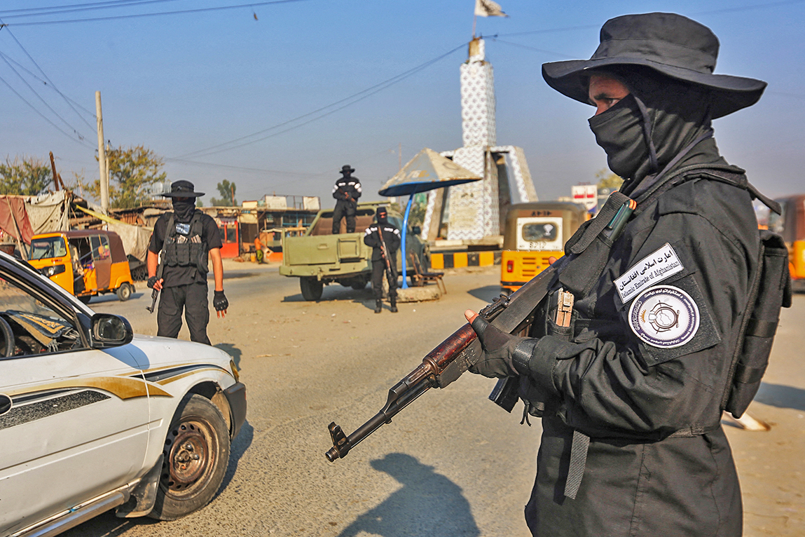 A member of the Taliban security forces stand guard at a checkpoint along a street in Jalalabad, Afghanistan, on December 6, 2022. (AFP/File)