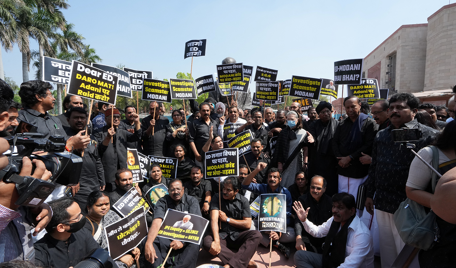 Indian lawmakers from various opposition parties wear black as they hold a protest after the opposition Congress party's leader Rahul Gandhi was disqualified as a lawmaker by India's parliament, inside the parliament premises in New Delhi, India, March 27, 2023. (REUTERS)