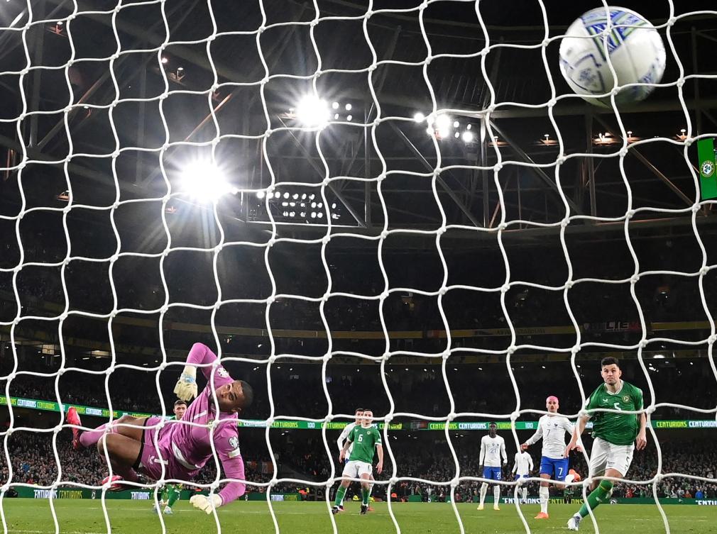 Ireland’s goalkeeper Gavin Bazunu sees a shot from France’s defender Benjamin Pavard hit the back of his net during their team’s UEFA Euro 2024 group B qualification football match. (AFP)