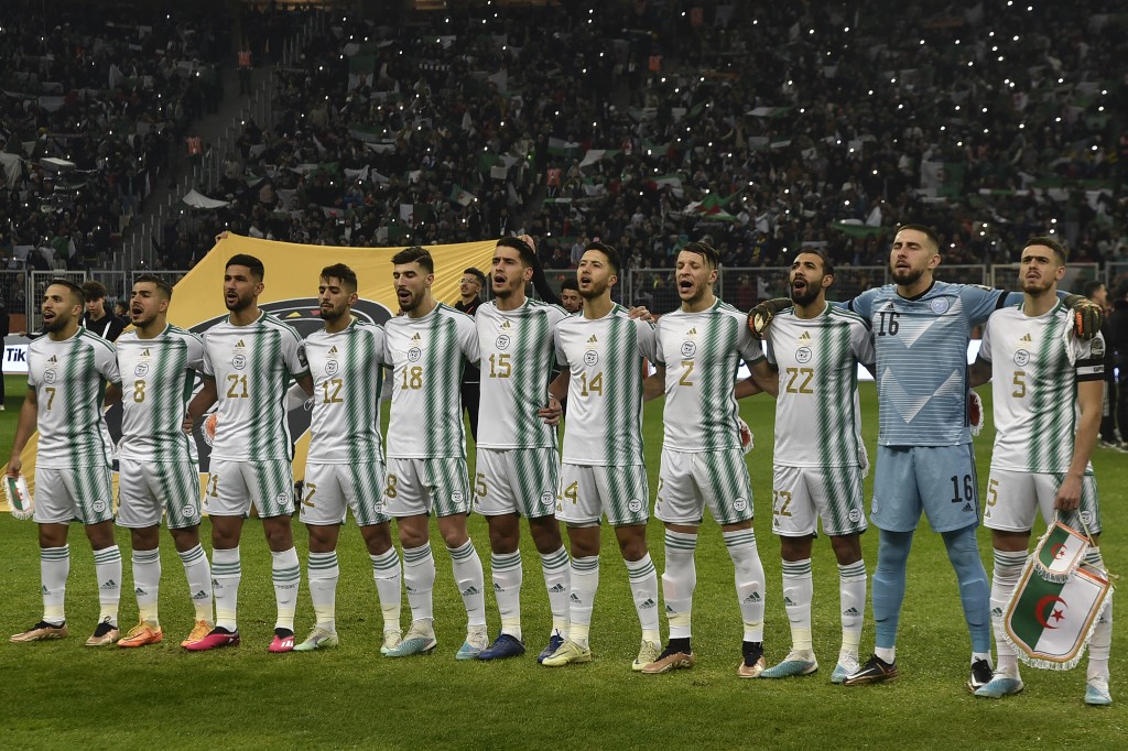 Algeria's players sing their national anthem ahead of the game (AFP)