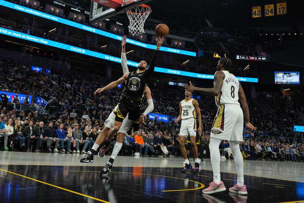 Stephen Curry of the Golden State Warriors drives to the basket during the second quarter of their NBA game against New Orleans Pelicans at Chase Center on Tuesday in San Francisco, California. (AFP)