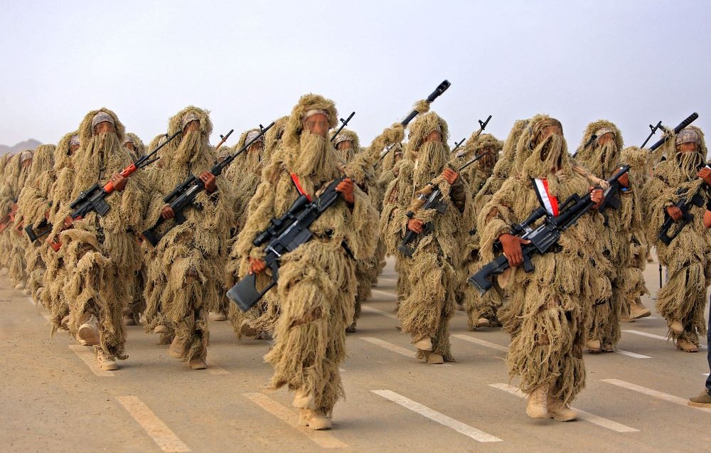 Fighters loyal to Yemen's government take part in a military parade marking the 56th anniversary of the 1962 revolution which established the Yemeni republic, Marib province, Sept. 26, 2022. (AFP)