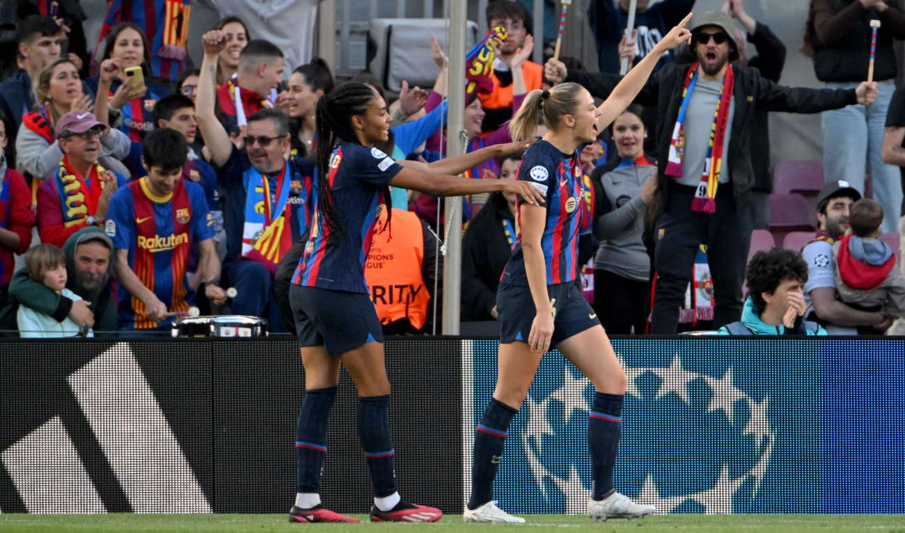Barcelona's Swedish forward Fridolina Rolfo (R) celebrates scoring her team's third goal during the UEFA Women's Champions League quarterfinal second leg between FC Barcelona and AS Roma at the Camp Nou stadium in Barcelona on Wednesday. (AFP)