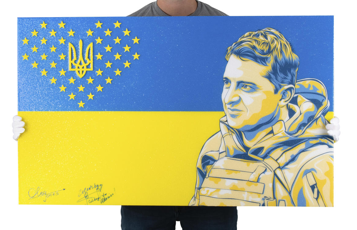 Painting by American artist Oleg Jones of Ukrainian President Volodymyr Zelenskyy that was signed by Zelenskyy. (AP)