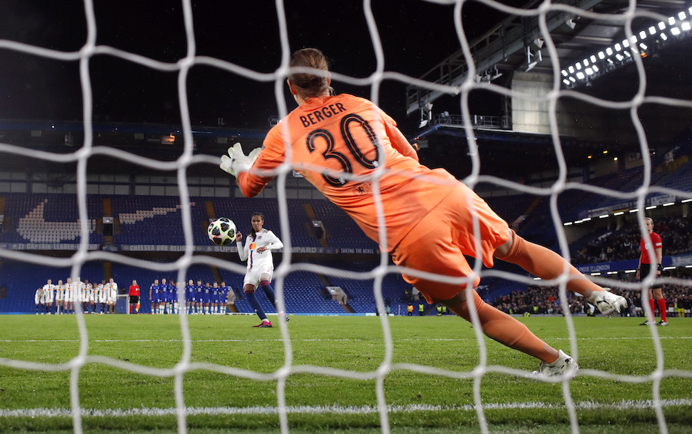 Chelsea's Ann-Katrin Berger saves a penalty from Olympique Lyonnais' Wendie Renard during the shootout in their Women’s Champions League quarterfinal second leg on Thursday. (Reuters)