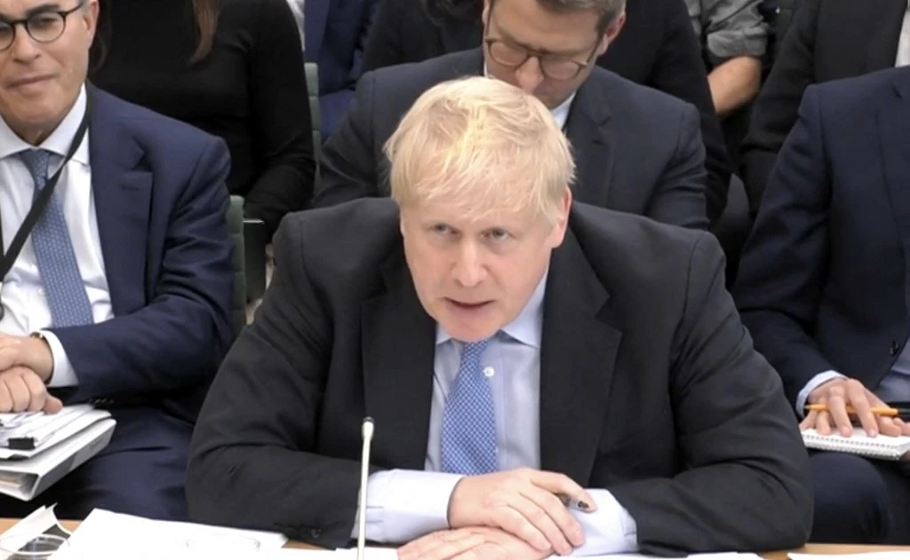 UK's former prime minister, Boris Johnson, attends a Parliamentary privileges committee hearing on March 22, 2023 (File/AFP)
