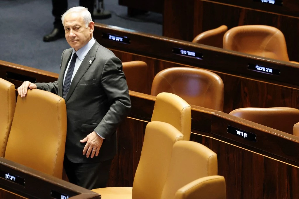 After weeks of protests, Israeli Prime Minister Benjamin Netanyahu announced a pause on the judicial reforms on Monday (AFP)