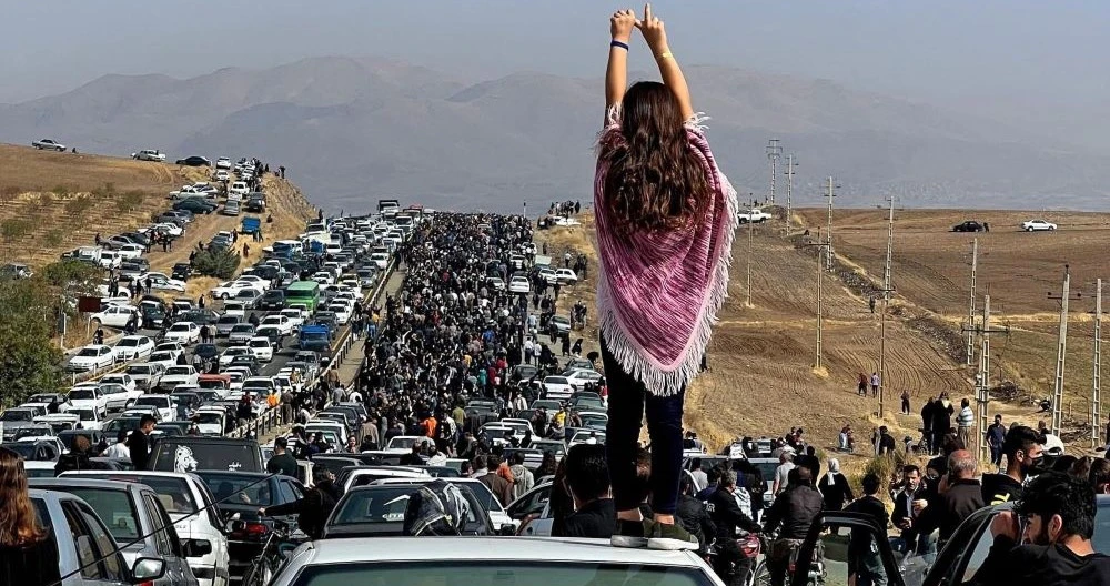 Mourners make their way toward Aichi cemetery in Saqez, Kurdistan, Iran, to mark 40 days since Mahsa Amini’s death. (AFP)