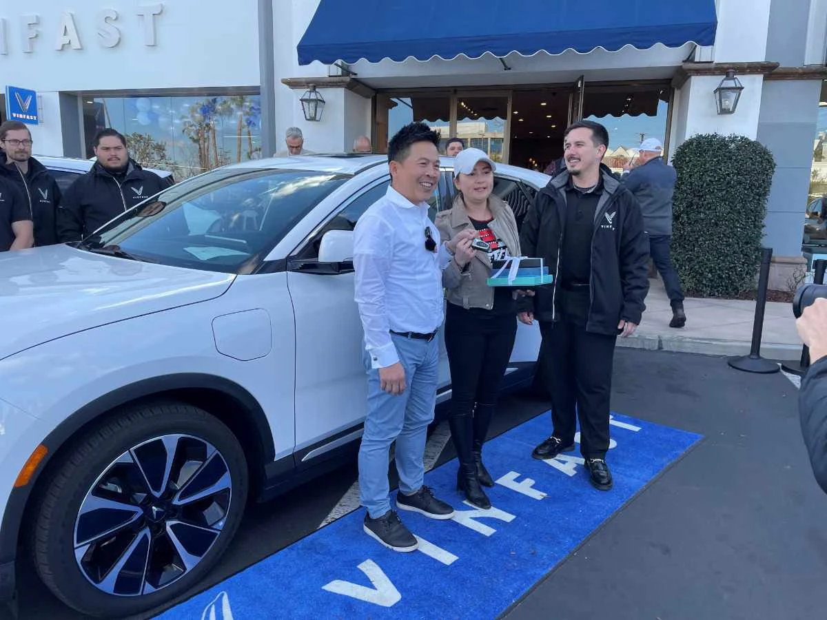 Buyers Andrew and Nikki Le take delivery of their VinFast electric car in Los Angeles, California, on March 1, 2023. (REUTERS)