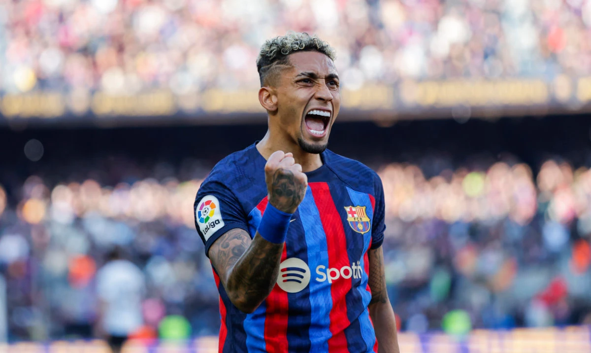 Barcelona's Raphinha celebrates scoring his side's opening goal during Spanish La Liga soccer match between Barcelona and Valencia at the Camp Nou stadium in Barcelona, Spain, Sunday, March 5, 2023. (AP)