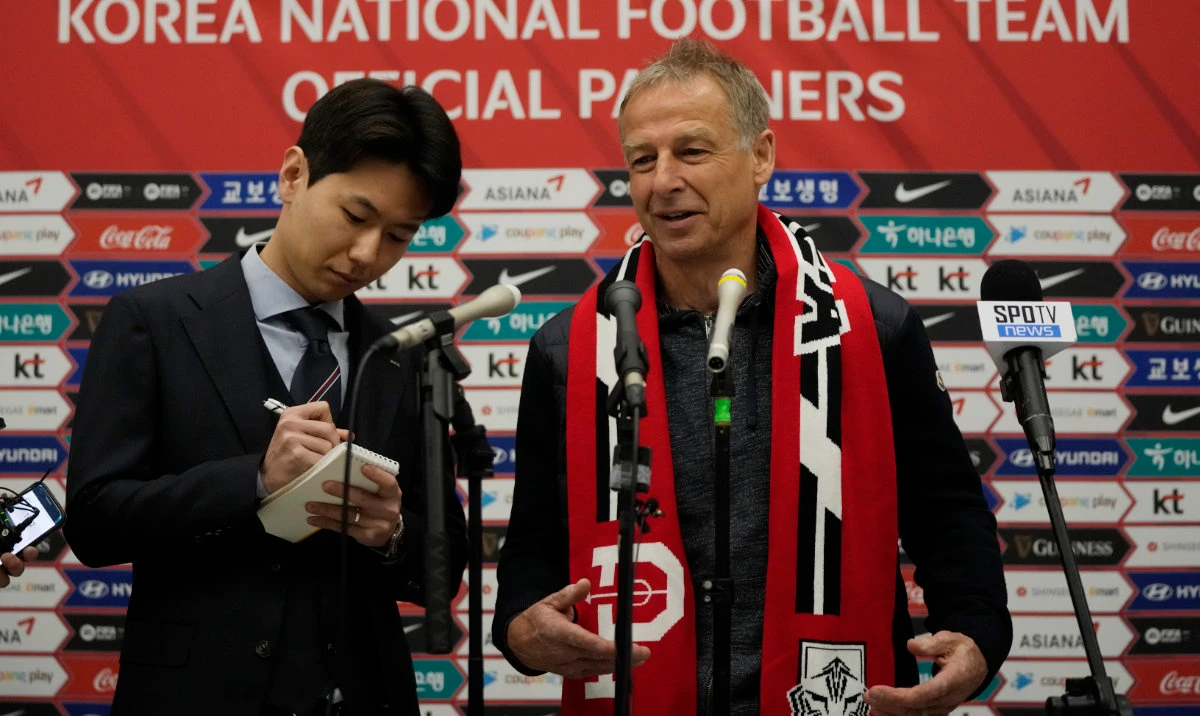 South Korea's new national soccer team head coach Jurgen Klinsmann, right, speaks during a press conference at the Incheon International Airport in Incheron, South Korea, Wednesday. (AP)