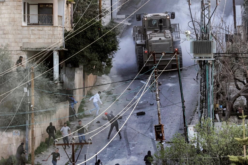 The Israeli attack on Jenin camp resulted in the killing of six Palestinians and dozens of injuries. (AFP)