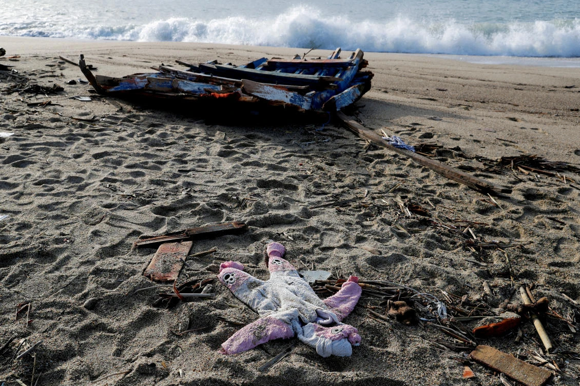 A piece of the boat and a piece of clothing from the deadly migrant shipwreck are seen in Steccato di Cutro near Crotone, Italy, on Feb. 28, 2023. (Reuters)
