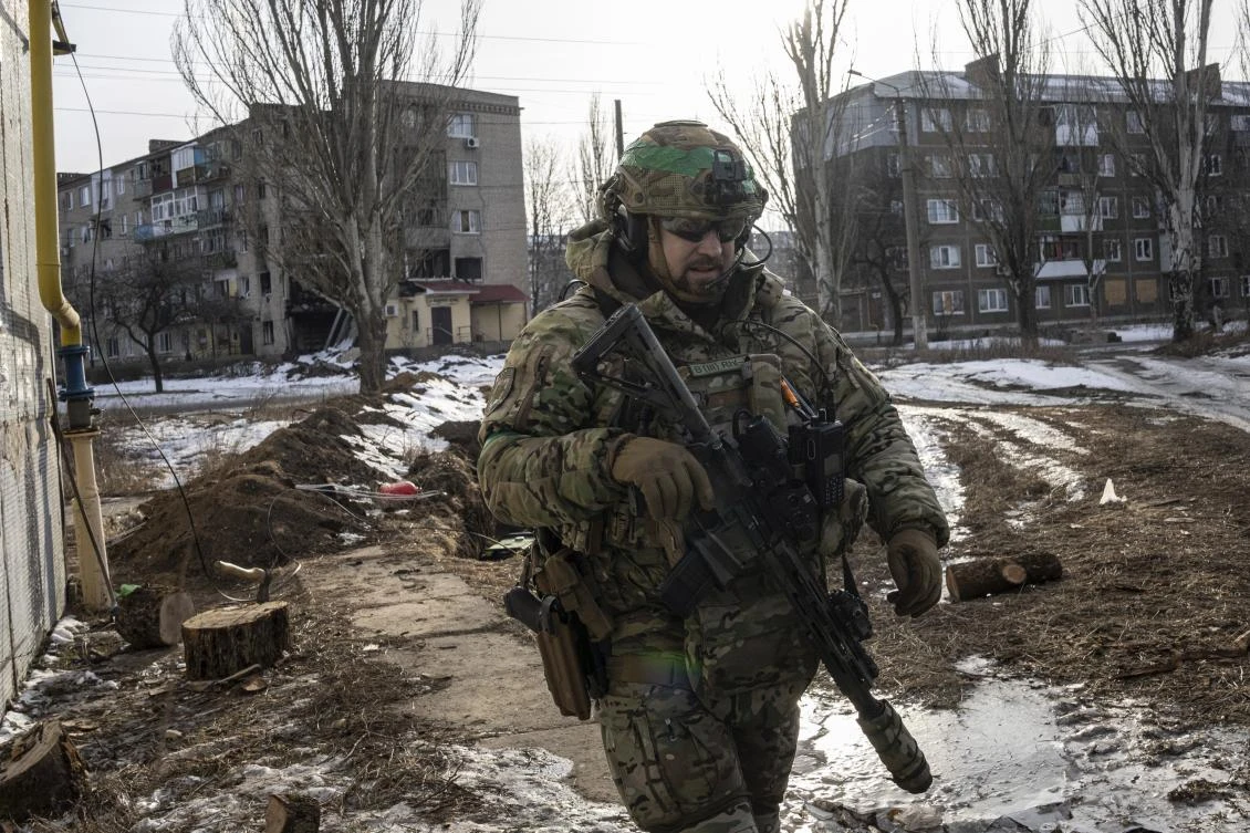 A Ukrainian serviceman patrols a street in Bakhmut, Ukraine on Feb. 24, 2023. (AP/File)
