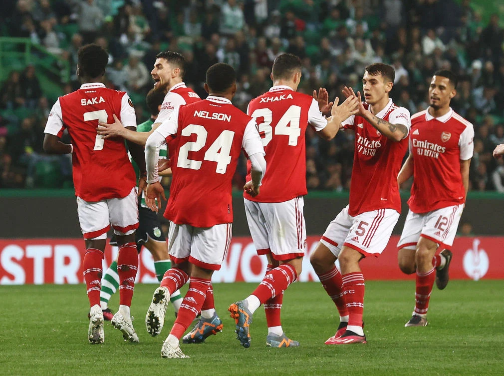 Arsenal’s Granit Xhaka celebrates their second goal with teammates an own goal scored by Sporting CP’s Hidemasa Morita during their Europa League round of 16 first leg match at Estadio Jose Alvalade, Lisbon on Mar. 9, 2023. (Reuters)