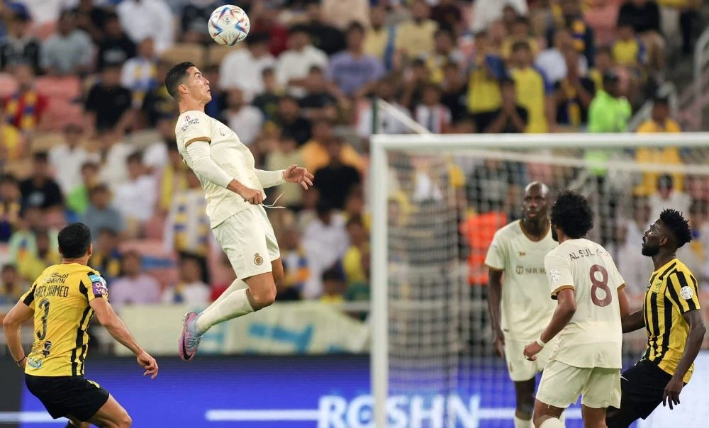 Al-Nassr’s Portuguese forward Cristiano Ronaldo heads the ball during the Saudi Pro League game against Al-Ittihad, King Abdullah Sport City Stadium, Jeddah, Saudi Arabia, Mar. 9, 2023. (AFP)