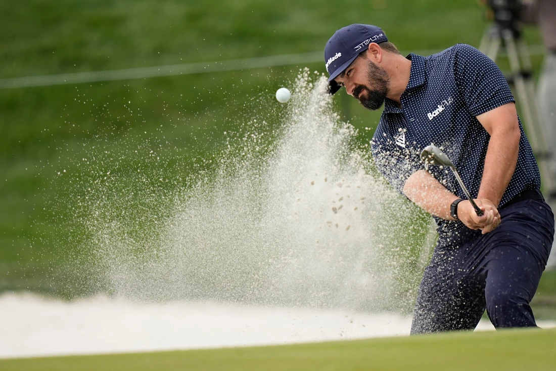 Chad Ramey hits out of a greenside bunker on the 15th hole during the first round of the Players Championship golf tournament in Ponte Vedra Beach, Fla. (AP)