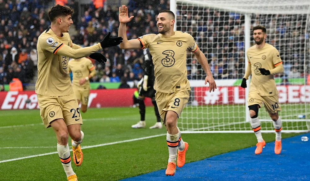 Chelsea's Croatian midfielder Mateo Kovacic (C) celebrates scoring the team's third goal during the English Premier League match between Leicester City and Chelsea at King Power Stadium in Leicester, central England on Saturday. (AFP)