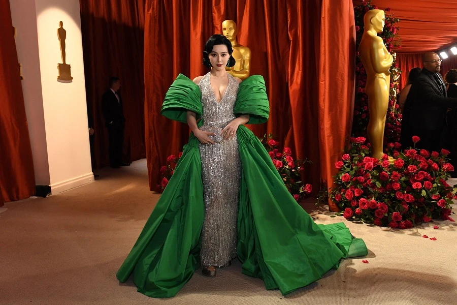 Chinese superstar Fan Bingbing made a regal entrance in a sparkling silver and emerald green gown created by Lebanese Italian designer Tony Ward. (AFP)
