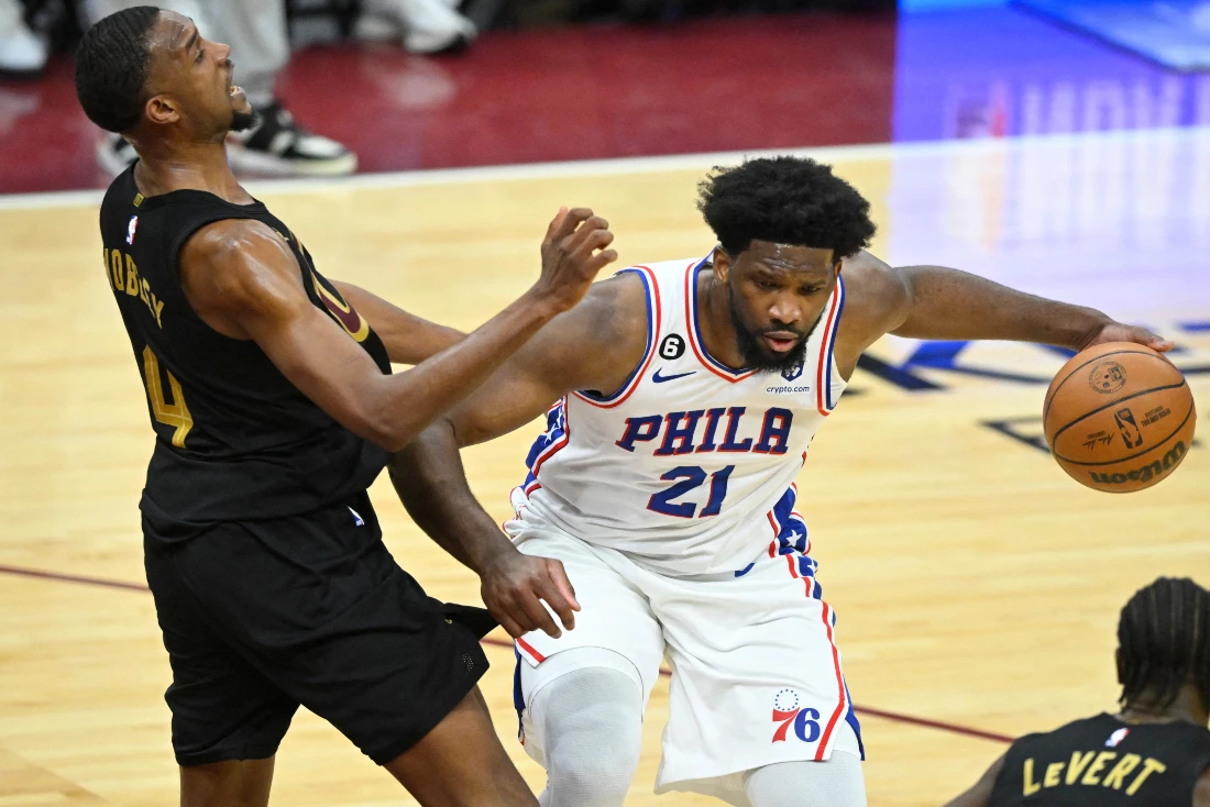 Philadelphia 76ers center Joel Embiid drives around Cleveland Cavaliers forward Evan Mobley in the fourth quarter of their NBA game at Rocket Mortgage FieldHouse. (Supplied)