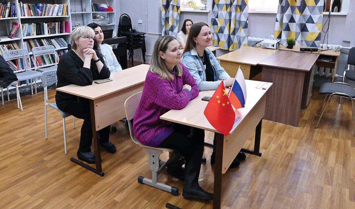 Adults attend a Chinese lesson at the ChineseFirst language center, in the town of Reutov, outside Moscow, on Friday. (AFP)