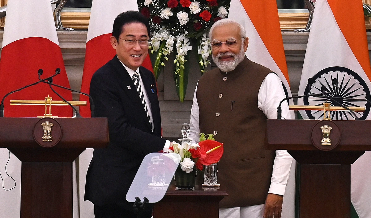 Japan's Prime Minister Fumio Kishida (L) shakes hands with his Indian counterpart Narendra Modi after attending a joint media briefing at the Hyderabad House in New Delhi on March 20, 2023. (Photo courtesy: AFP)