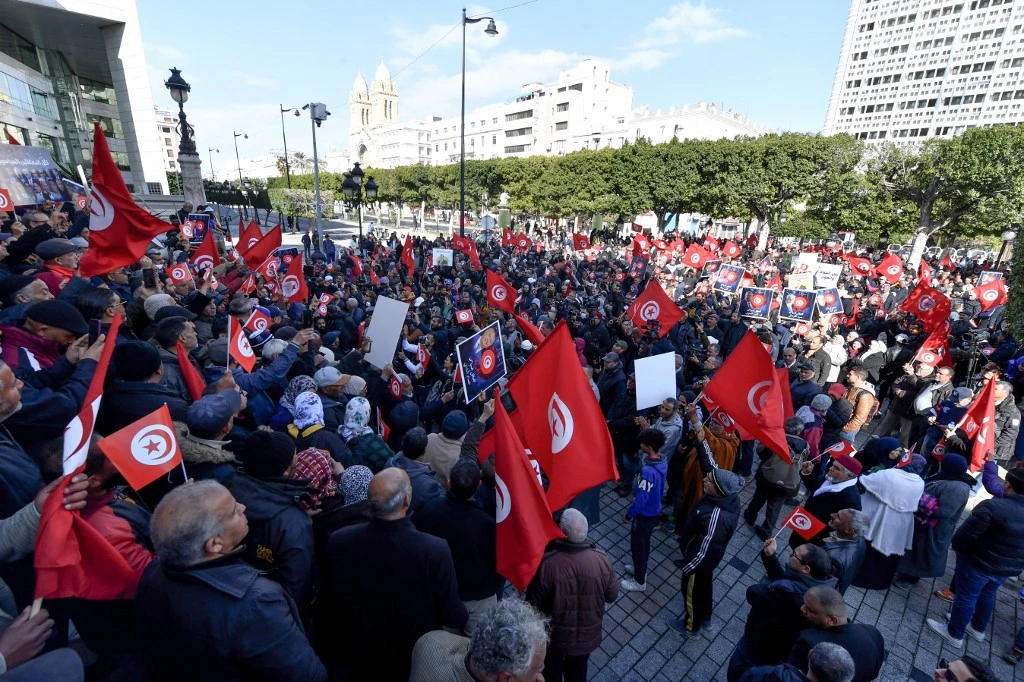 People take part in a demonstration in Tunis (AFP)
