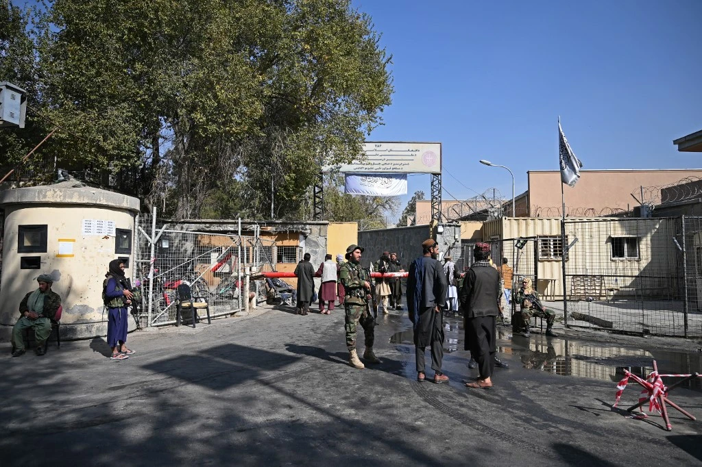 Taliban fighters stand guard at an entrance gate of the Sardar Mohammad Dawood Khan military hospital in Kabul on November 3, 2021. (AFP)