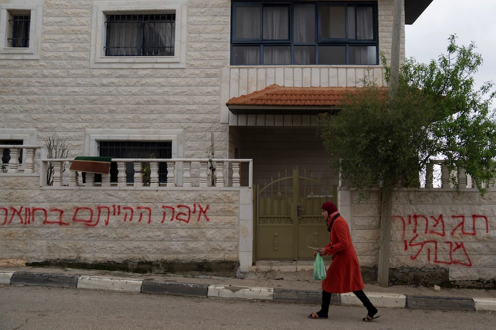 Suspected Israeli settlers vandalized residents’ properties overnight in the West Bank village of Burqa, near Ramallah, Tuesday, March 21, 2023. (AP)