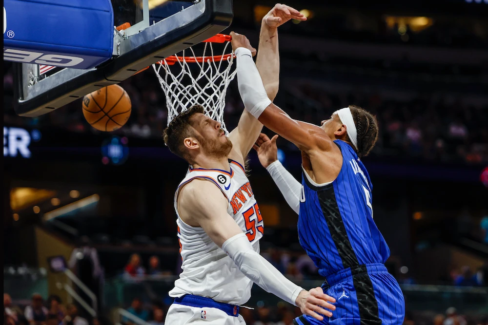 Orlando Magic forward Paolo Banchero, right, dunks over New York Knicks center Isaiah Hartenstein during the second half of an NBA basketball game Thursday in Orlando, Florida. (AP)