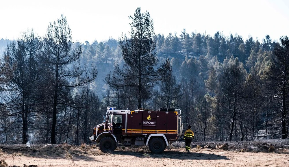 A fire truck is pictured in a forest area near the village of Los Peiros, on Mar. 25, 2023, affected by a wildfire that began on Mar. 23 near Villanueva de Viver, some 90 kilometres north of Valencia. (AFP)