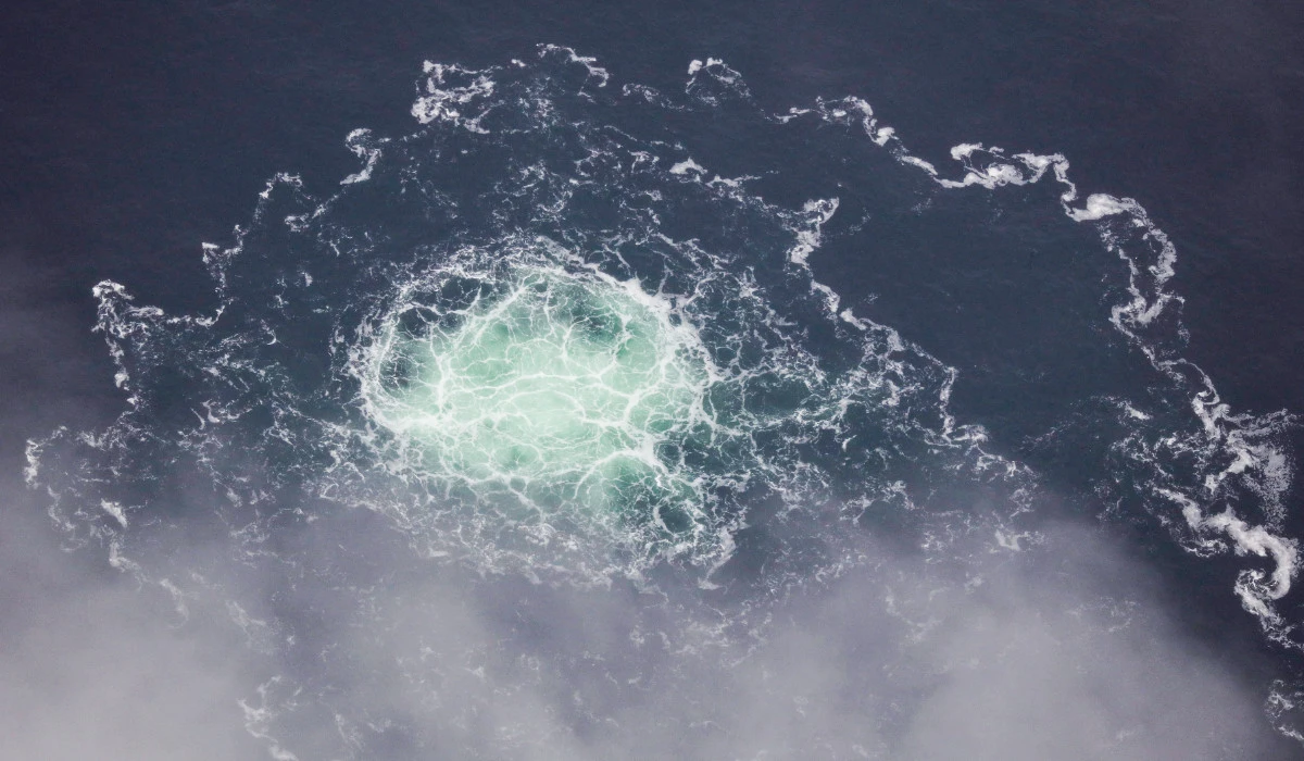 This handout photo taken on September 28, 2022 from an aircraft of the Swedish Coast Guard (Kustbevakningen) shows the release of gas emanating from a leak on the Nord Stream 2 gas pipeline, in the Swedish economic zone in the Baltic Sea. (AFP)
