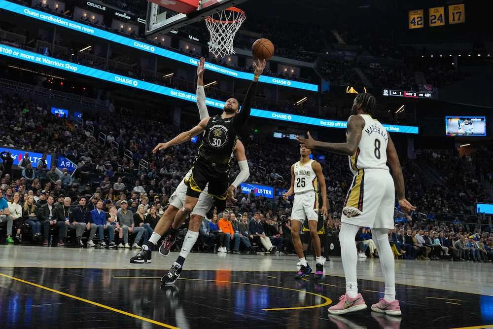 Stephen Curry of the Golden State Warriors drives to the basket during the second quarter of their NBA game against New Orleans Pelicans at Chase Center on Tuesday in San Francisco, California. (AFP)