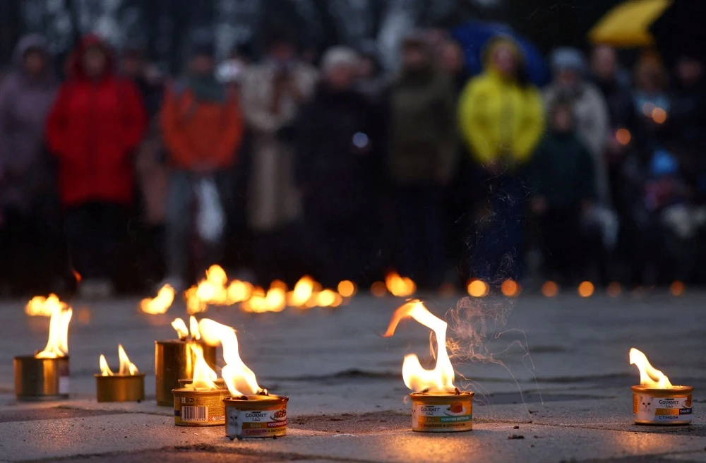 People attend a vigil marking the first anniversary of the liberation of the town of Bucha, amid Russia’s attack on Ukraine in Bucha, outside Kyiv, Ukraine March 31, 2023. (Reuters)