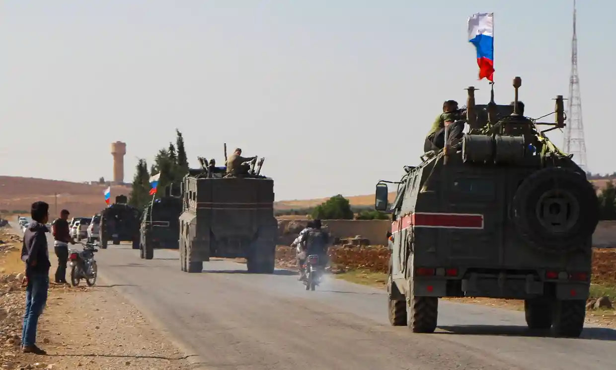 A convoy of Russian military vehicles drives towards the north-eastern Syrian town of Kobane. (AFP)