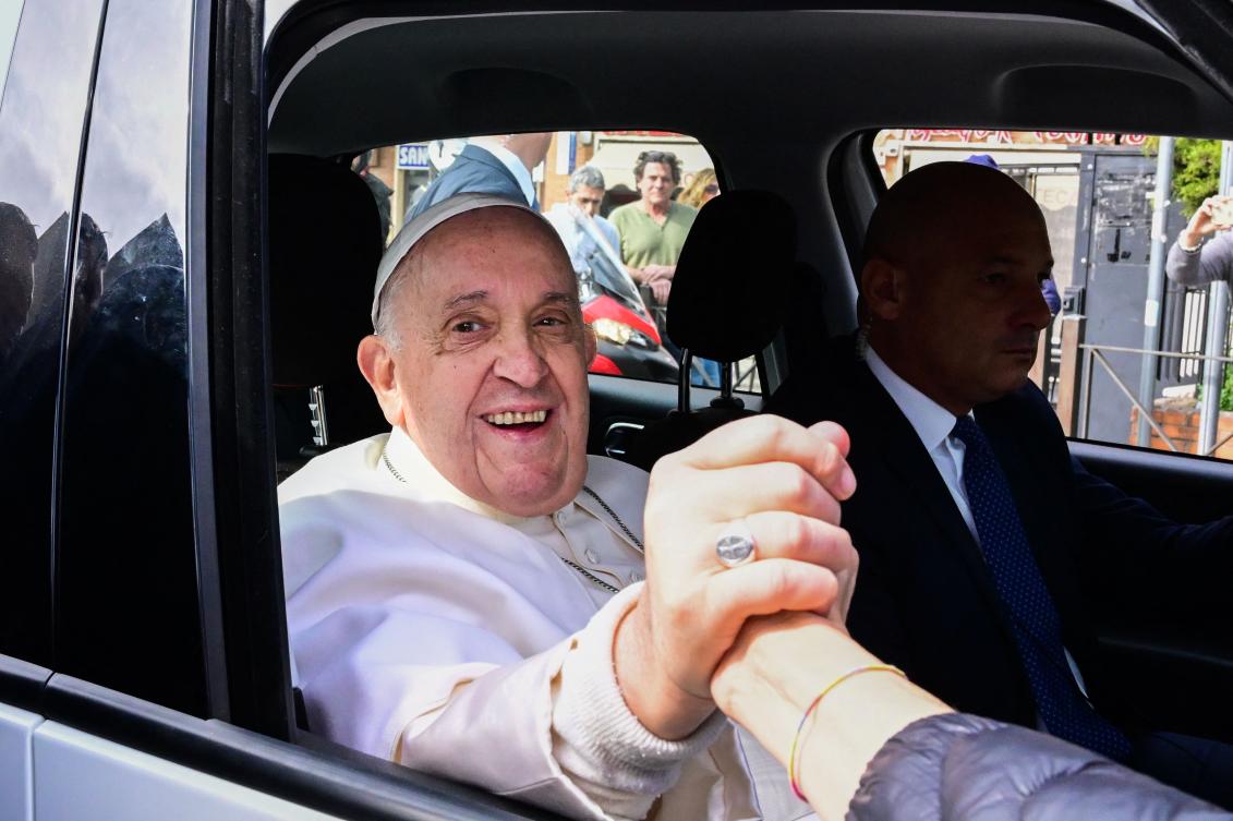 Pope Francis leaves the Gemelli hospital in Rome, after being discharged following treatment for bronchitis. The 86-year-old pontiff was admitted to Gemelli hospital on March 29 after suffering from breathing difficulties. (AFP)