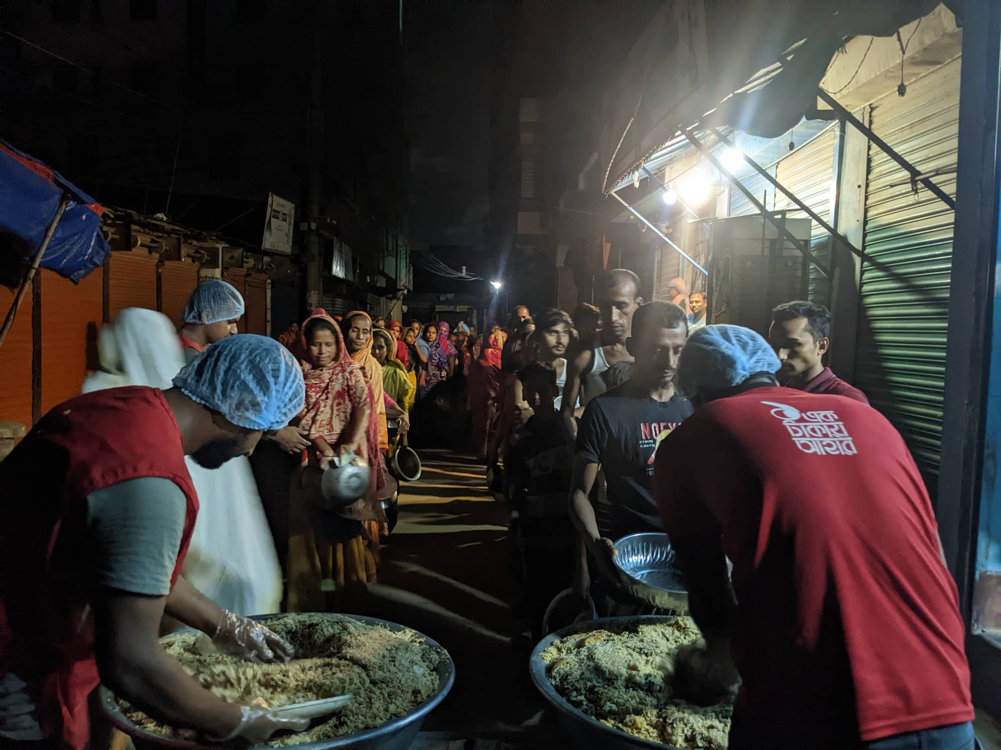 Volunteers distribute food among the poor during the holy month of Ramadan in Dhaka, Bangladesh, on March 31, 2023. (AN Photo)