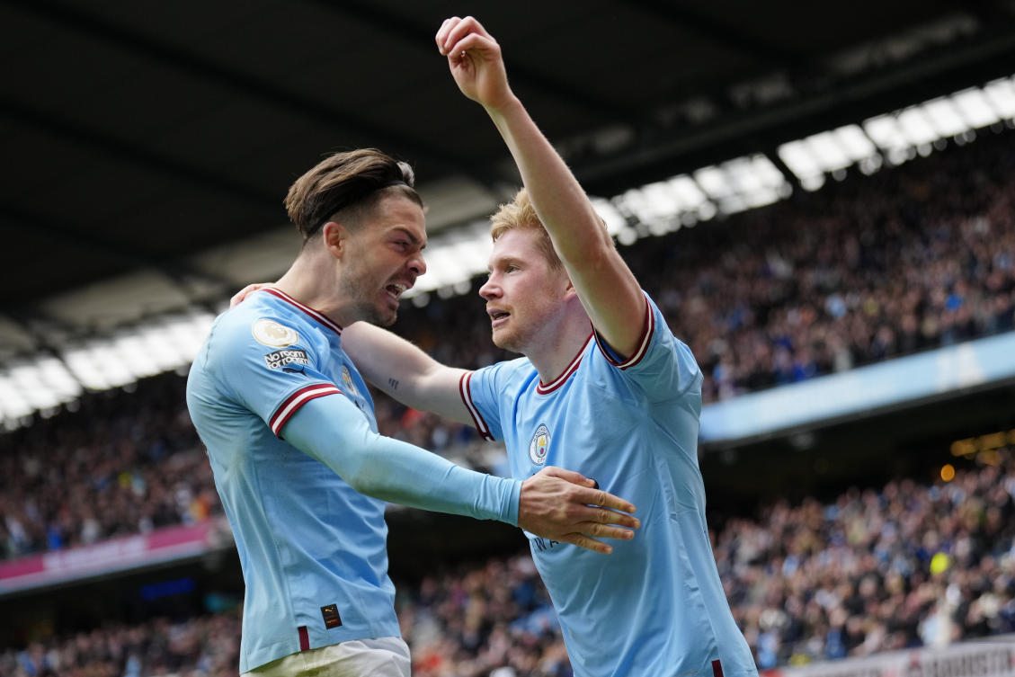 Manchester City’s Kevin De Bruyne celebrates with teammate Jack Grealish after scoring his side’s 2nd goal during their Premier League match against Liverpool at Etihad stadium in Manchester on Apr. 1, 2023. (AP)