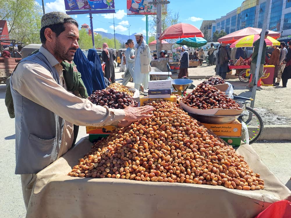 An Afghan fruit seller displays local dates at a market in Kabul on April 1, 2023, but few are able to afford the Ramadan staple amid skyrocketing prices of food. (AN Photo)
