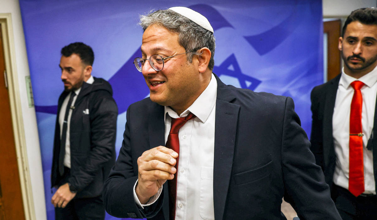 Israel's National Security Minister Itamar Ben-Gvir (C) arrives for the weekly meeting at the prime minister's office in Jerusalem on April 2, 2023. (AFP)