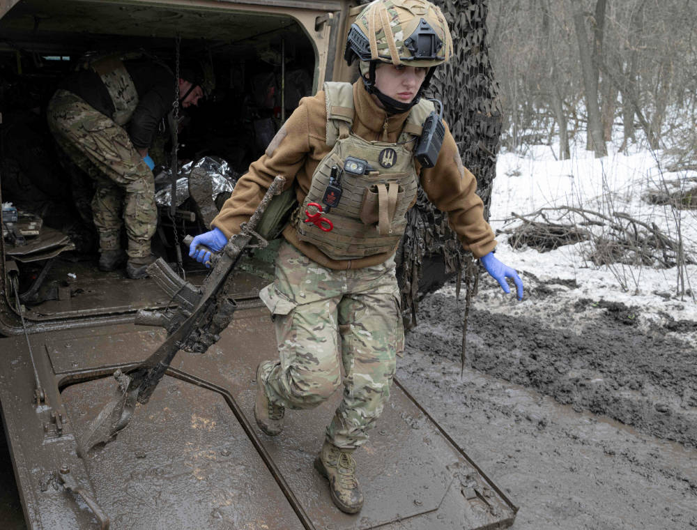 Medics from the Da Vinci Wolves Battalion evacuate a lightly wounded Ukrainian serviceman near the frontline near Bakhmut, Donetsk region, on April 1, 2023, amid the Russian invasion of Ukraine. (AFP)