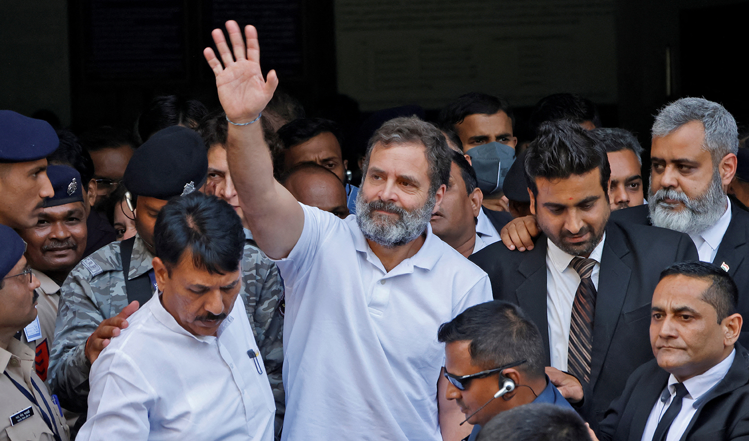 Rahul Gandhi, a senior leader of India's main opposition Congress party, waves as he leaves a court after he lodged an appeal against his conviction for defamation, in Surat in the western state of Gujarat, India, on April 3, 2023. (REUTERS)