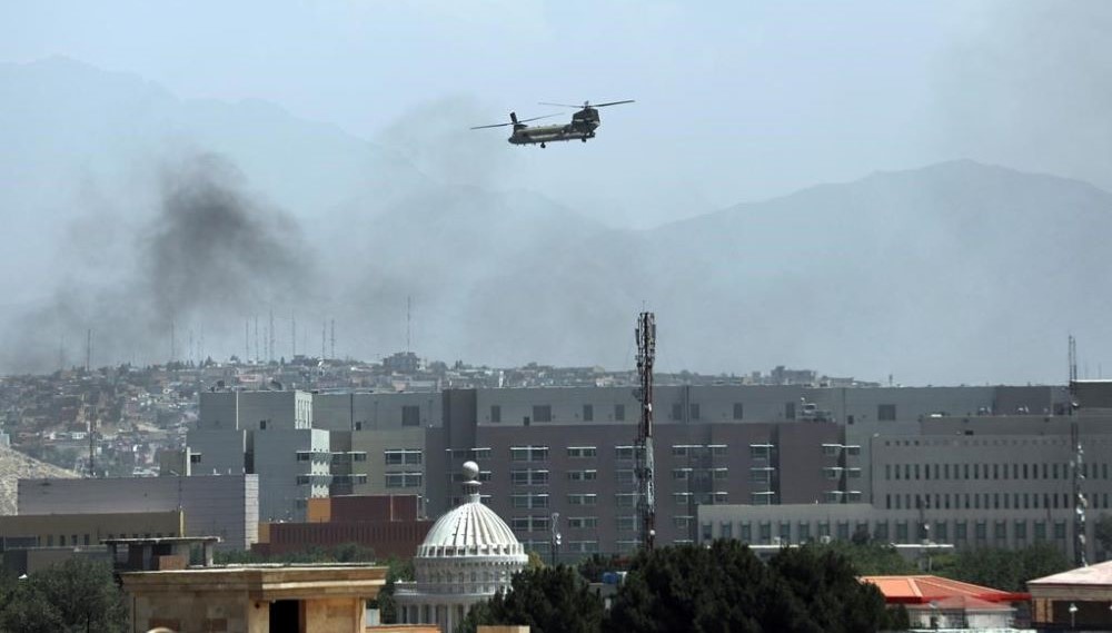 A Chinook heavy-lift helicopter flies over the city of Kabul, Afghanistan, Aug. 15, 2021. (AP Photo)