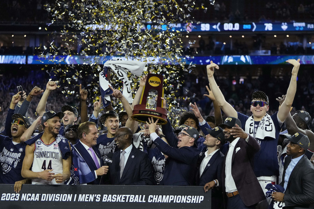 Connecticut Huskies players celebrate after defeating the San Diego State Aztecs Monday in the national championship game of the 2023 NCAA Tournament at NRG Stadium. (USA TODAY Sports)