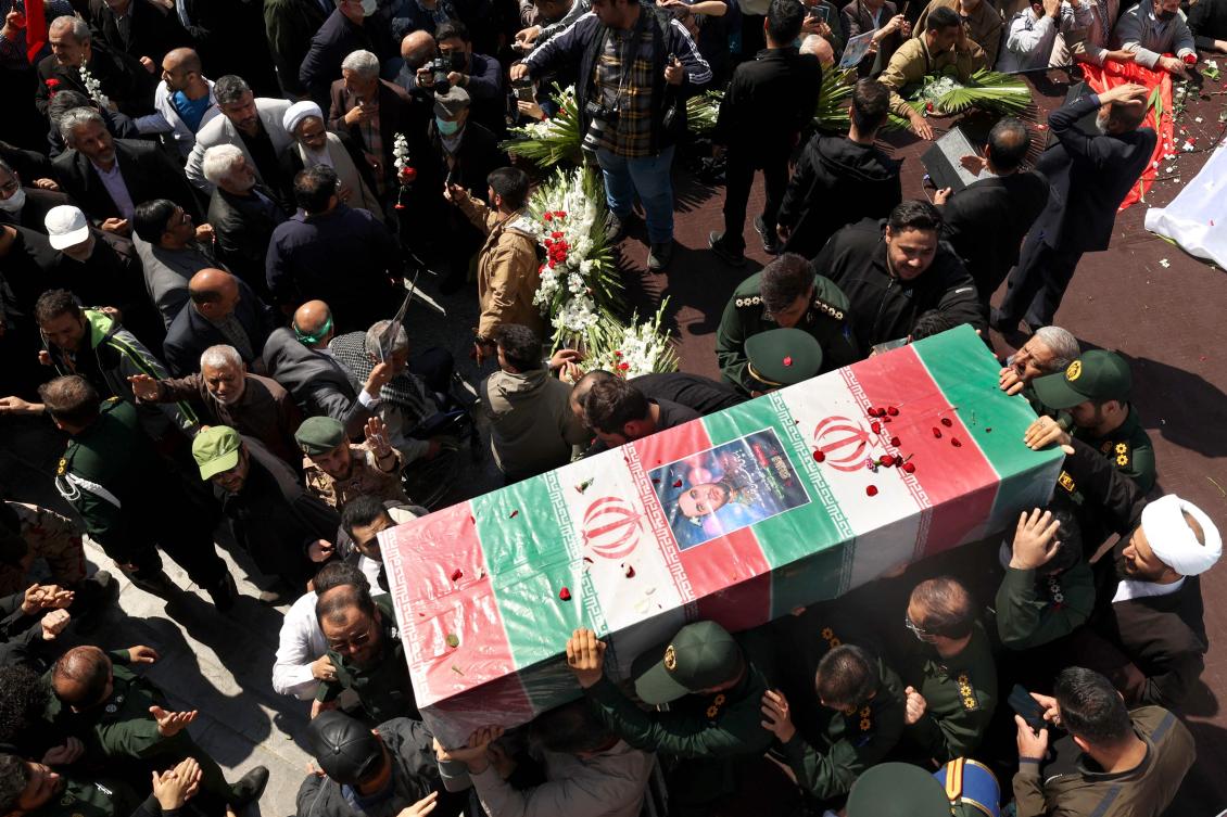 Mourners attend the funeral procession for two of Iran’s revolutionary guard forces killed by Israel in Syria on April 4, 2023. (AFP)