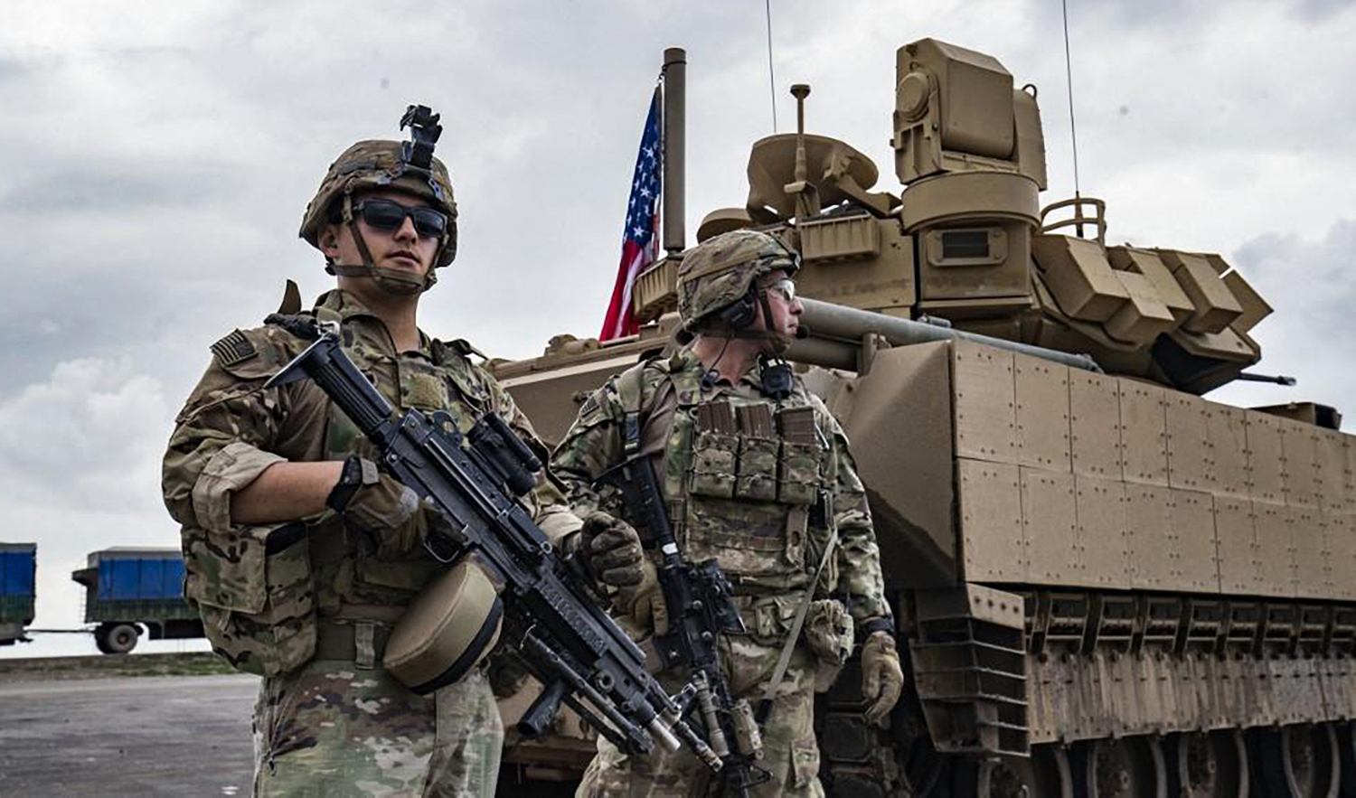 Above, American troops deployed on the outskirts of Rumaylan in Syria’s northeastern Hasakeh province, bordering Turkey, on March 27, 2023. (AFP/File)