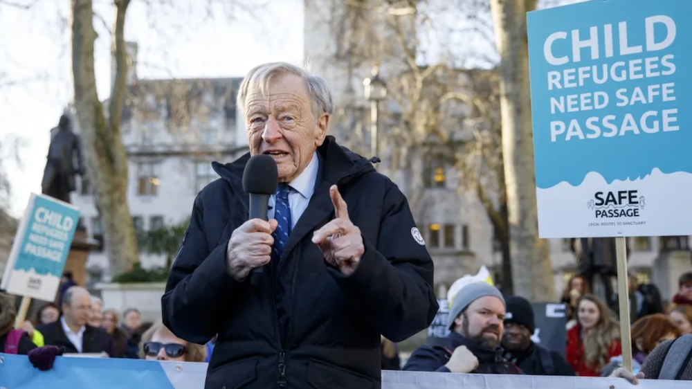 Lord Alfred Dubs, a British legislator who fled Nazi Germany as a little boy, speaks at a protest demanding protection of the rights of refugee children. (AFP)