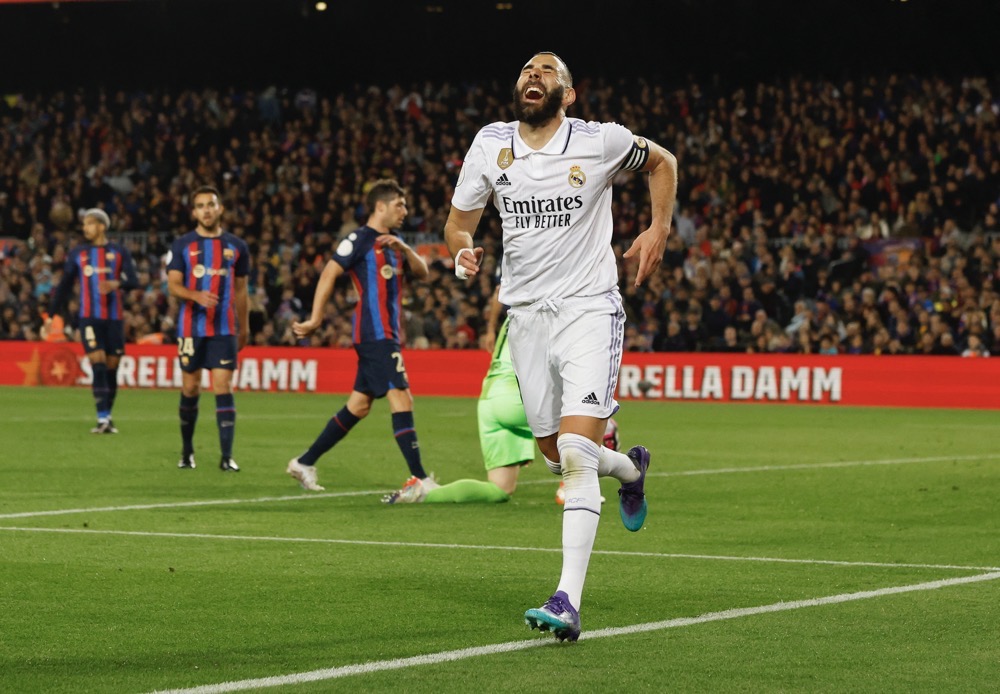 Real Madrid’s Karim Benzema celebrates scoring their fourth goal to complete his hat-trick. (Reuters)